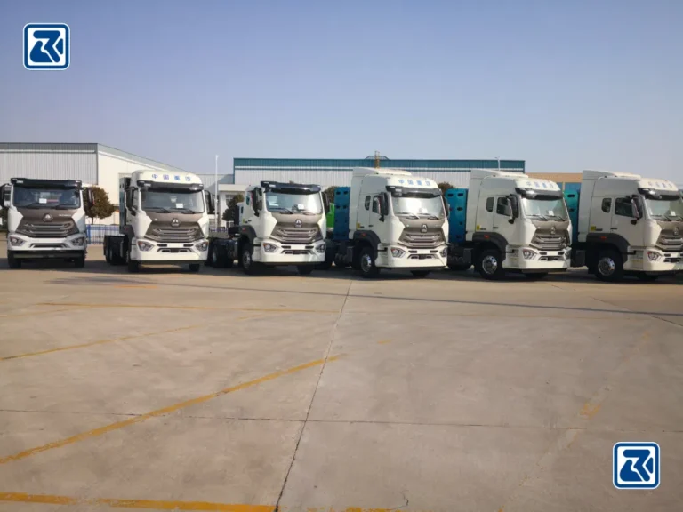 A number of HOWO tractor trailers are lined up to demonstrate the variety of models available to meet different transport needs.